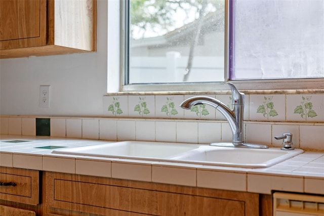885 Little Bend Rd, Altamonte Springs, FL 32714 - kitchen view of a sink, tile countertops, and brown cabinets
