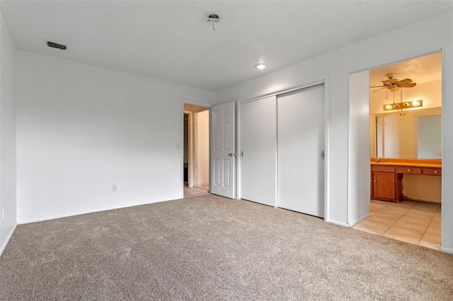 885 Little Bend Rd, Altamonte Springs, FL 32714 - unfurnished bedroom with light carpet, a closet, ensuite bath, and baseboards