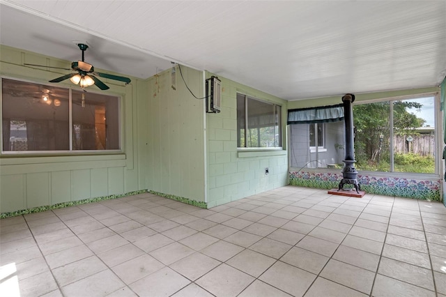 885 Little Bend Rd, Altamonte Springs, FL 32714 - unfurnished sunroom with a wood stove