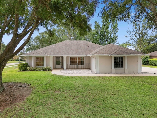 11648 Grand Bay Blvd, Clermont, FL 34711 - view of front of home with a front yard and stucco siding