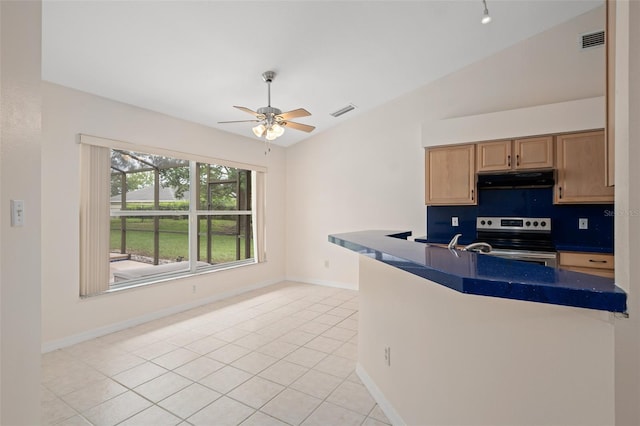 11648 Grand Bay Blvd, Clermont, FL 34711 - kitchen with stainless steel range with electric cooktop, under cabinet range hood, a ceiling fan, dark countertops, and baseboards