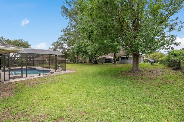 11648 Grand Bay Blvd, Clermont, FL 34711 - view of green lawn featuring an outdoor pool and glass enclosure