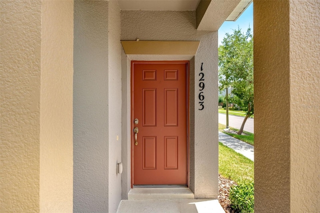 12963 Garridan Ave, Windermere, FL 34786 - property entrance with stucco siding