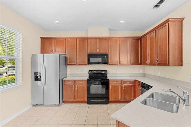 12963 Garridan Ave, Windermere, FL 34786 - kitchen with black appliances, a sink, healthy amount of natural light, light countertops, and recessed lighting