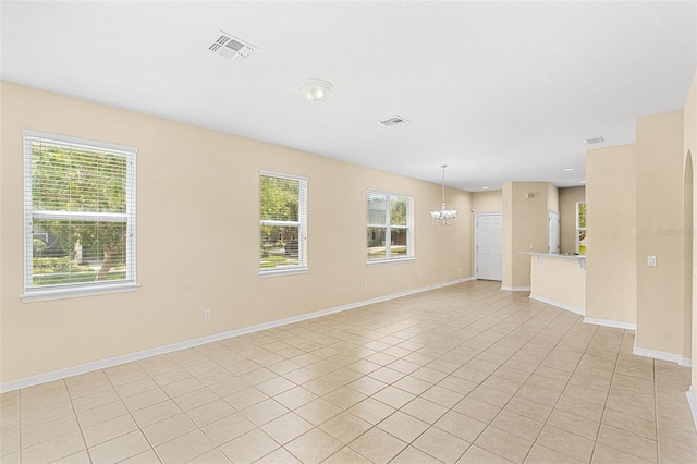 12963 Garridan Ave, Windermere, FL 34786 - unfurnished room featuring a chandelier, light tile patterned flooring, and baseboards