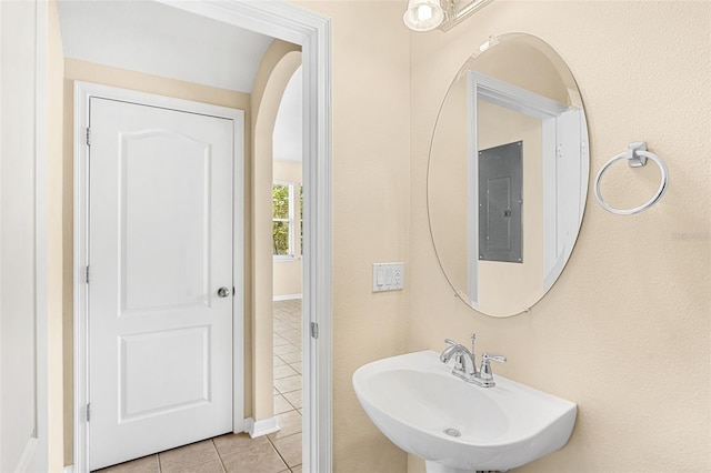 12963 Garridan Ave, Windermere, FL 34786 - bathroom featuring electric panel, a sink, and tile patterned floors