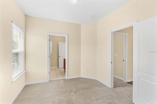 12963 Garridan Ave, Windermere, FL 34786 - spare room with healthy amount of natural light, light colored carpet, and baseboards