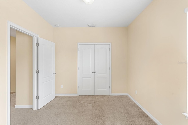 12963 Garridan Ave, Windermere, FL 34786 - unfurnished bedroom featuring carpet flooring, a closet, and baseboards