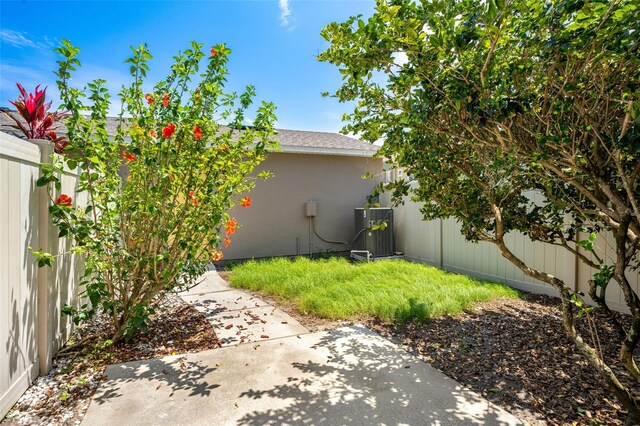12963 Garridan Ave, Windermere, FL 34786 - fenced backyard with a patio and central AC