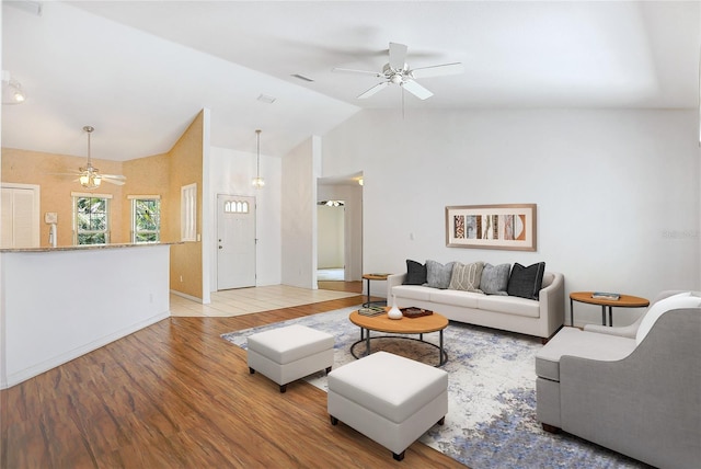 5382 SW 84th Pl, Ocala, FL 34476 - living room featuring a ceiling fan, wood finished floors, lofted ceiling, and baseboards