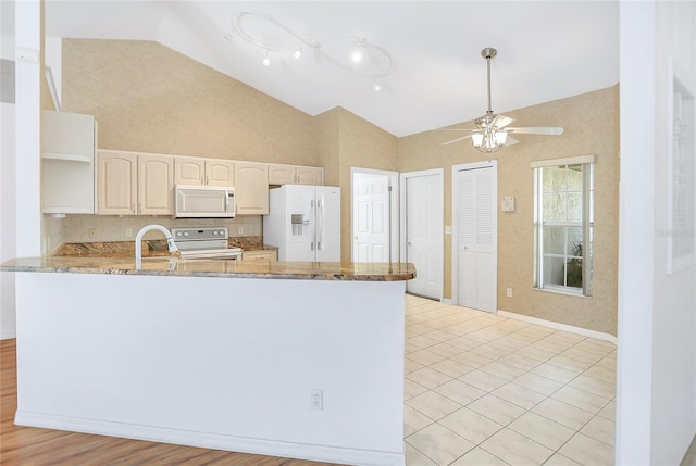 5382 SW 84th Pl, Ocala, FL 34476 - kitchen featuring white appliances, high vaulted ceiling, open shelves, a peninsula, and ceiling fan