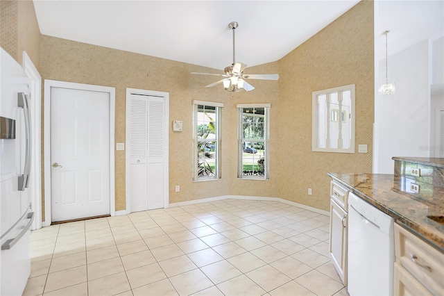 5382 SW 84th Pl, Ocala, FL 34476 - kitchen featuring white appliances, a ceiling fan, light tile patterned flooring, lofted ceiling, and wallpapered walls