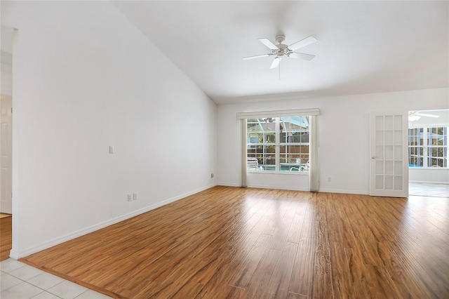 5382 SW 84th Pl, Ocala, FL 34476 - unfurnished room with a ceiling fan, healthy amount of natural light, light wood finished floors, lofted ceiling, and baseboards