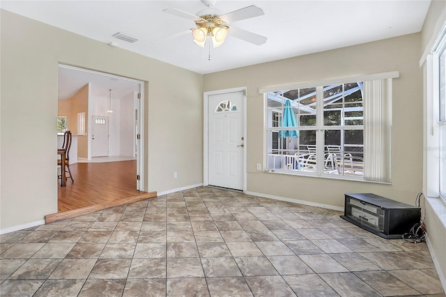 5382 SW 84th Pl, Ocala, FL 34476 - entrance foyer with healthy amount of natural light, ceiling fan, and baseboards