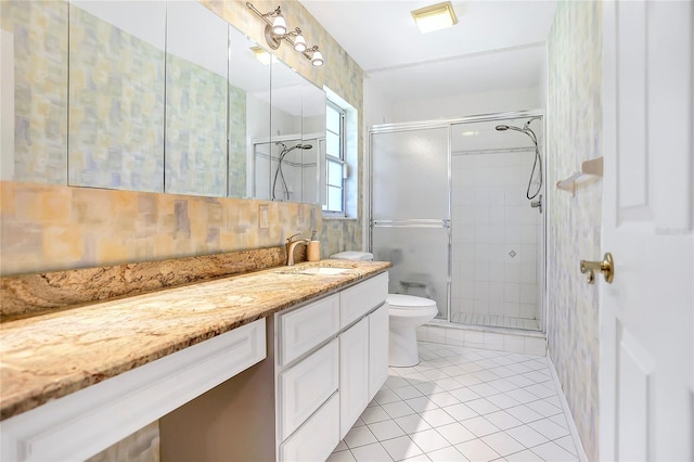 5382 SW 84th Pl, Ocala, FL 34476 - full bath featuring vanity, a stall shower, toilet, and tile patterned floors