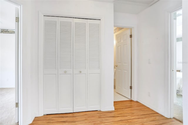 5382 SW 84th Pl, Ocala, FL 34476 - unfurnished bedroom featuring light wood-type flooring, a closet, and baseboards