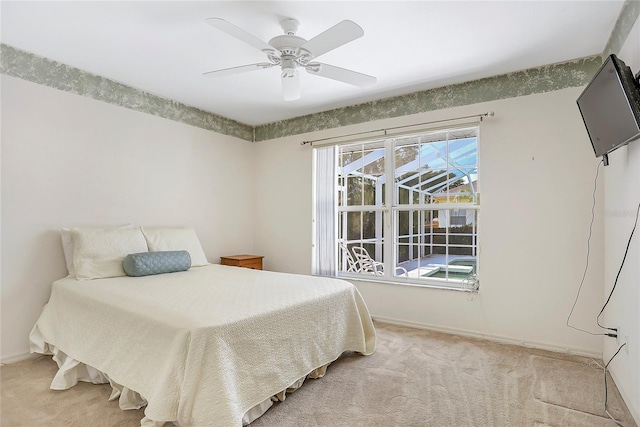 5382 SW 84th Pl, Ocala, FL 34476 - bedroom featuring light carpet, baseboards, and a ceiling fan