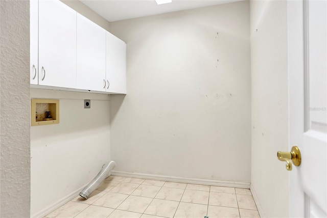 5382 SW 84th Pl, Ocala, FL 34476 - laundry area with electric dryer hookup, cabinet space, washer hookup, baseboards, and light tile patterned flooring