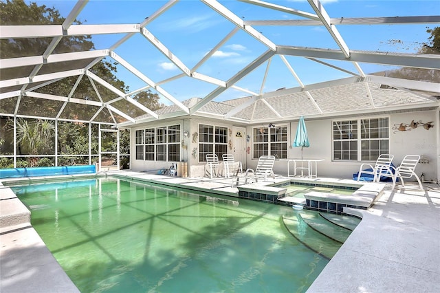 5382 SW 84th Pl, Ocala, FL 34476 - view of swimming pool featuring a patio, a pool with connected hot tub, and glass enclosure