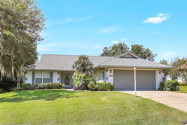 5382 SW 84th Pl, Ocala, FL 34476 - ranch-style home featuring an attached garage, concrete driveway, a front lawn, stucco siding, and a shingled roof