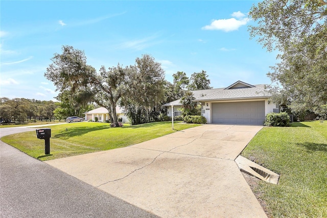 5382 SW 84th Pl, Ocala, FL 34476 - view of front of home with a front yard, driveway, an attached garage, and stucco siding