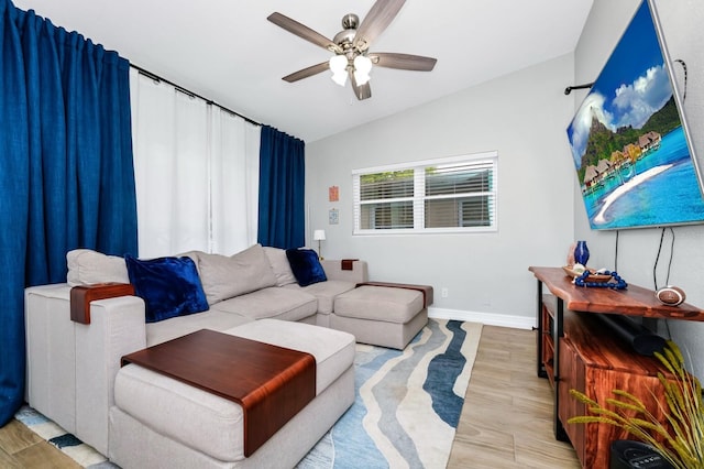 7616 Simms Ave, Orlando, FL 32812 - living room featuring ceiling fan, baseboards, vaulted ceiling, and wood finished floors