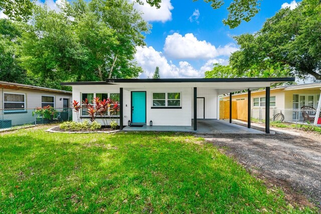 7616 Simms Ave, Orlando, FL 32812 - view of front of house with driveway and an attached carport