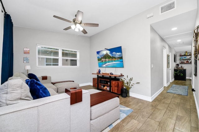 7616 Simms Ave, Orlando, FL 32812 - living area with ceiling fan, recessed lighting, baseboards, wood finished floors, and attic access