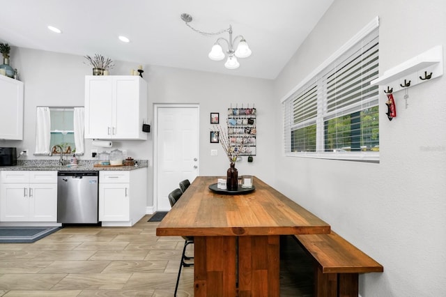 7616 Simms Ave, Orlando, FL 32812 - kitchen featuring dishwasher, white cabinetry, a chandelier, light stone counters, and recessed lighting