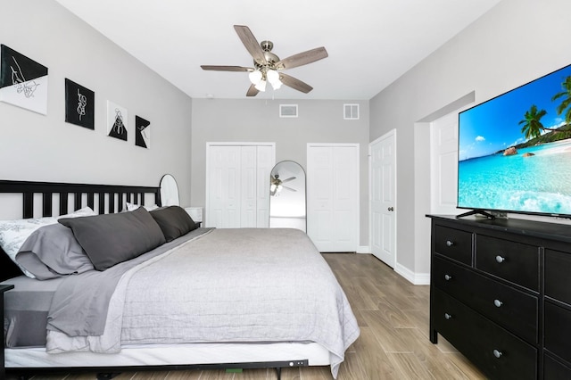 7616 Simms Ave, Orlando, FL 32812 - bedroom with light wood-style floors, two closets, baseboards, and a ceiling fan