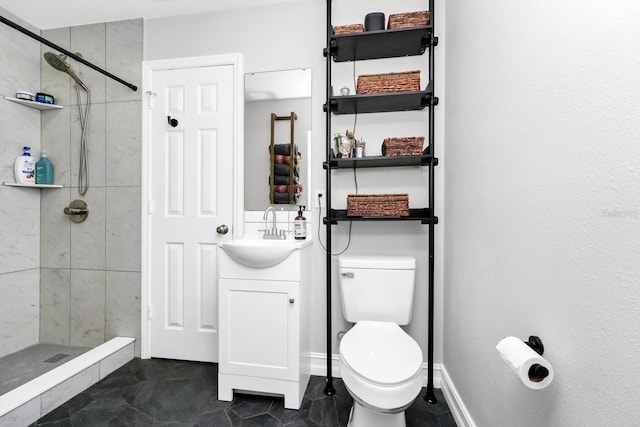 7616 Simms Ave, Orlando, FL 32812 - bathroom featuring a shower stall, toilet, and vanity