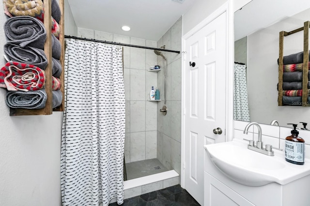 7616 Simms Ave, Orlando, FL 32812 - bathroom with vanity, a tile shower, and recessed lighting