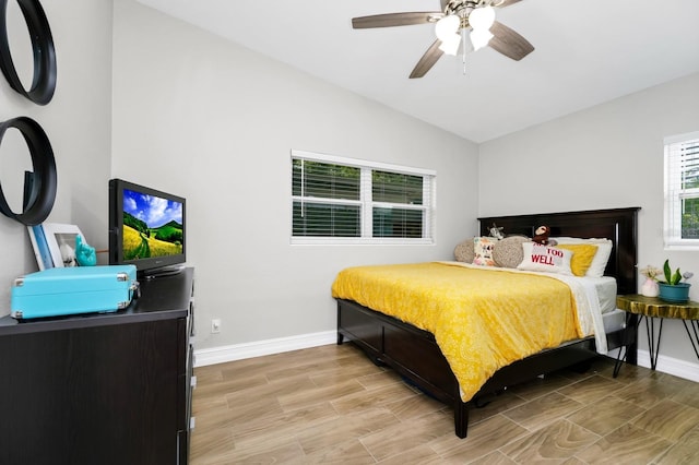 7616 Simms Ave, Orlando, FL 32812 - bedroom featuring vaulted ceiling, baseboards, light wood-style flooring, and a ceiling fan