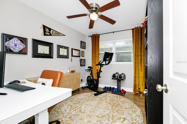 7616 Simms Ave, Orlando, FL 32812 - office area featuring ceiling fan, wood finished floors, and baseboards