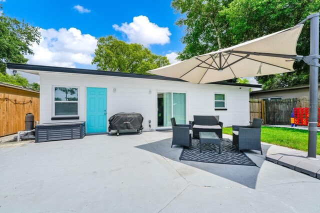 7616 Simms Ave, Orlando, FL 32812 - back of property with a patio
