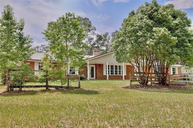 4802 Anton Ave, Apopka, FL 32712 - view of front of property featuring brick siding and a chimney