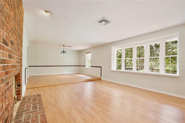 4802 Anton Ave, Apopka, FL 32712 - empty room with a textured ceiling, wood finished floors, and baseboards