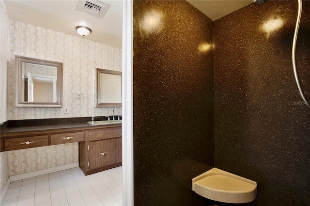 4802 Anton Ave, Apopka, FL 32712 - bathroom featuring wallpapered walls, tile patterned flooring, vanity, and baseboards