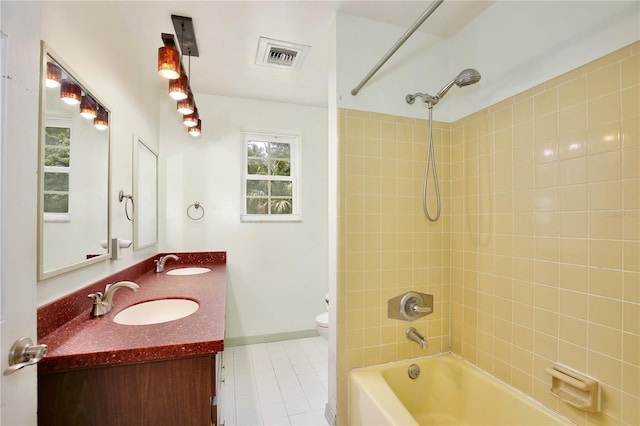 4802 Anton Ave, Apopka, FL 32712 - full bath with shower / washtub combination, double vanity, toilet, tile patterned floors, and baseboards