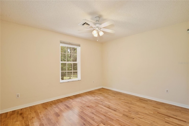 4802 Anton Ave, Apopka, FL 32712 - unfurnished room with light wood-style floors, ceiling fan, baseboards, and a textured ceiling
