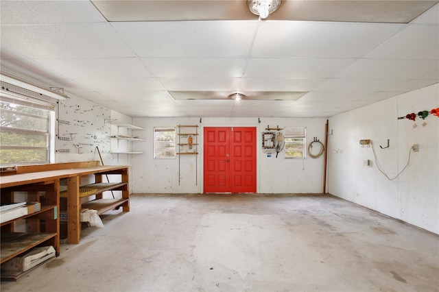 4802 Anton Ave, Apopka, FL 32712 - interior space with a drop ceiling, unfinished concrete floors, healthy amount of natural light, and a workshop area
