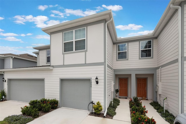 1900 Erudite Way, Winter Park, FL 32792 - view of property with concrete driveway and a garage
