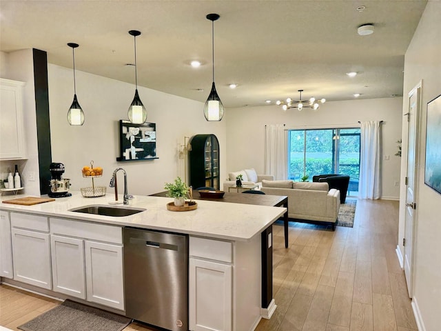1900 Erudite Way, Winter Park, FL 32792 - kitchen featuring dishwasher, a sink, light wood finished floors, white cabinetry, and recessed lighting