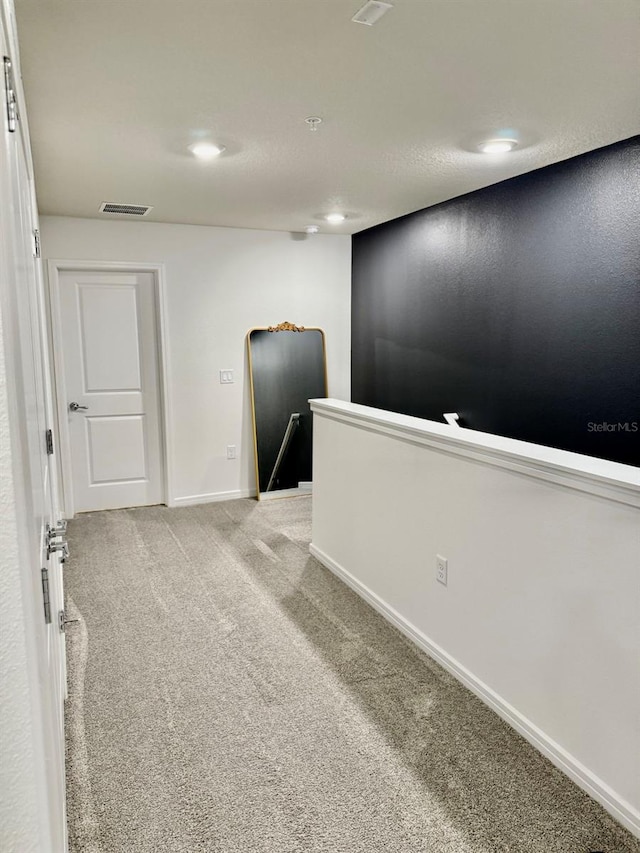 1900 Erudite Way, Winter Park, FL 32792 - spare room featuring light carpet, baseboards, fire sprinkler in ceiling, and recessed lighting