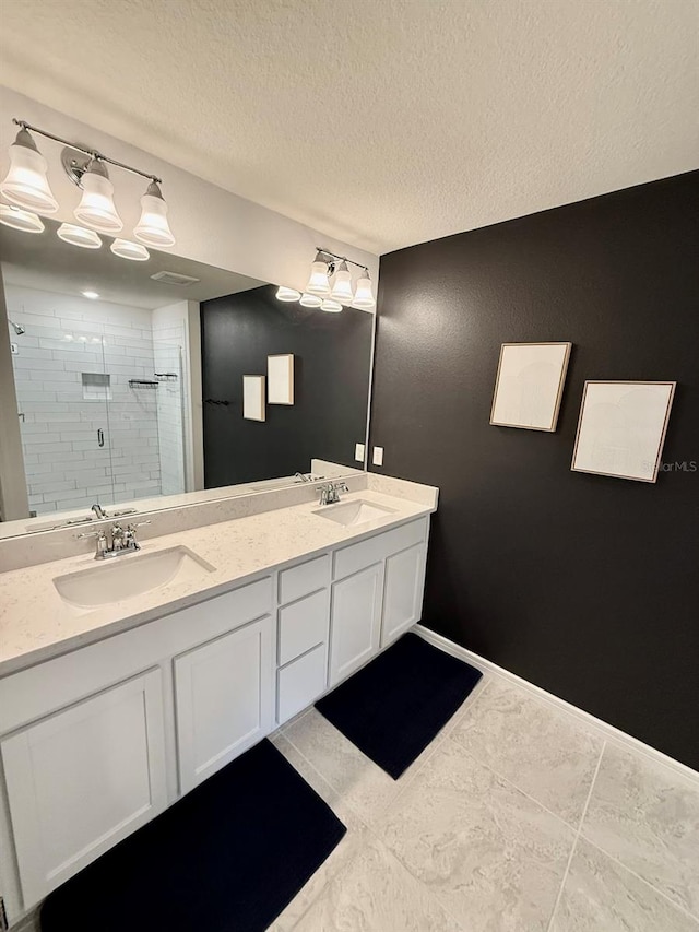 1900 Erudite Way, Winter Park, FL 32792 - full bathroom featuring a shower stall, double vanity, a textured ceiling, tile patterned flooring, and baseboards