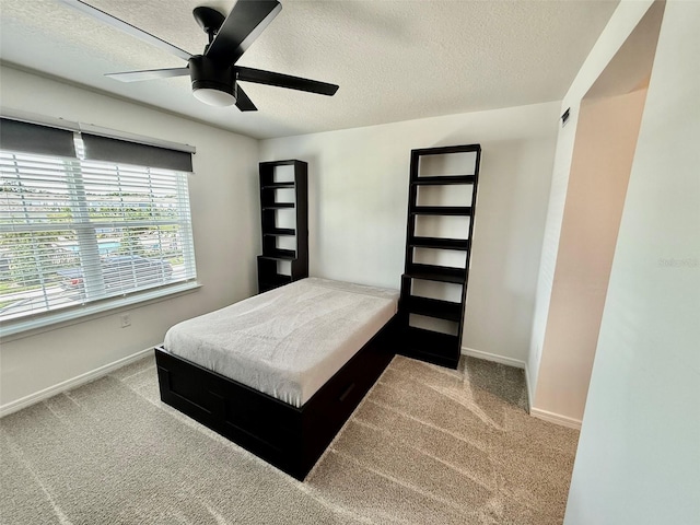 1900 Erudite Way, Winter Park, FL 32792 - bedroom featuring a textured ceiling, carpet, baseboards, and ceiling fan