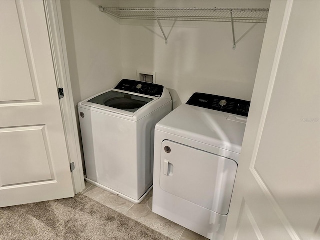 1900 Erudite Way, Winter Park, FL 32792 - laundry area featuring washer and clothes dryer and light tile patterned floors