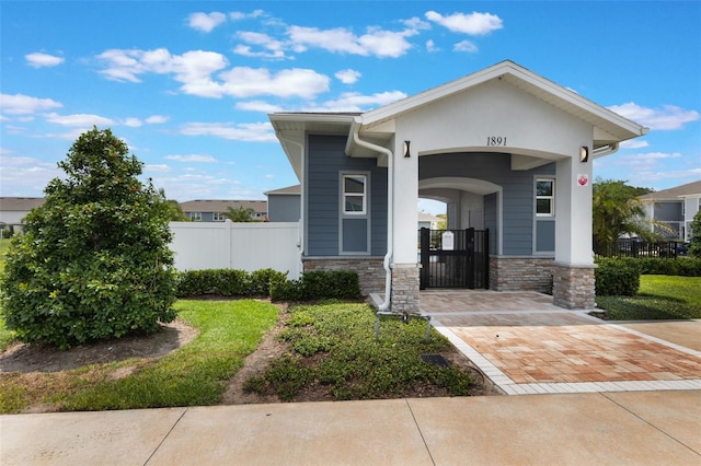 1900 Erudite Way, Winter Park, FL 32792 - view of front of house featuring stone siding and covered porch