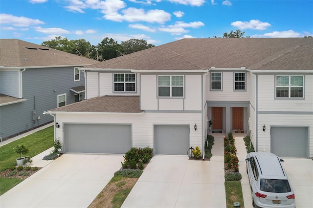 1900 Erudite Way, Winter Park, FL 32792 - view of front of property featuring concrete driveway, a shingled roof, and a garage