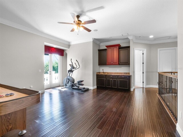 1417 Terralago Pl, Oviedo, FL 32765 - exercise area featuring ceiling fan, baseboards, a sink, dark wood finished floors, and crown molding